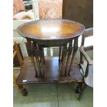 A nest of three reproduction, oval, mahogany coffee tables