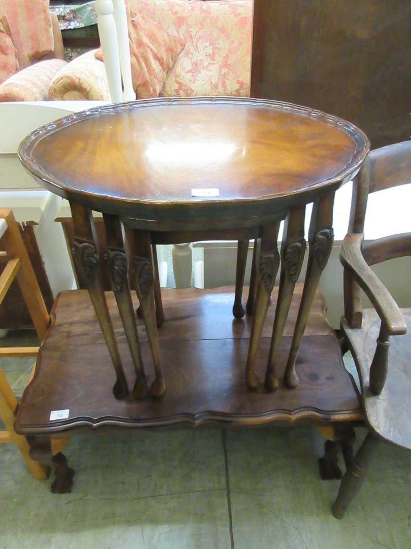 A nest of three reproduction, oval, mahogany coffee tables