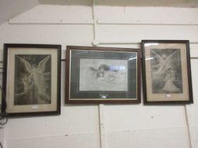 A set of three oak framed and glazed monochrome prints of angels