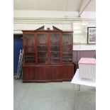 A reproduction mahogany and glazed breakfront display cabinet with cupboards under