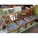 A set of four 1950s beech dining chairs