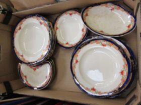 A part early 20th century blue and gilt decorated set of plates