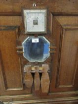 An early 20th century oak framed barometer and mirror