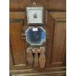 An early 20th century oak framed barometer and mirror