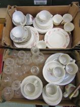 Two trays of ceramic and glassware to include drinking vessels, plates, cups, saucers, etc