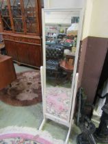 A modern cream cheval mirror