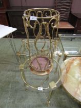 A modern ornate brass and marble finish stick stand