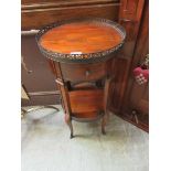A reproduction circular gallery top occasional table, with shelf to the under tier
