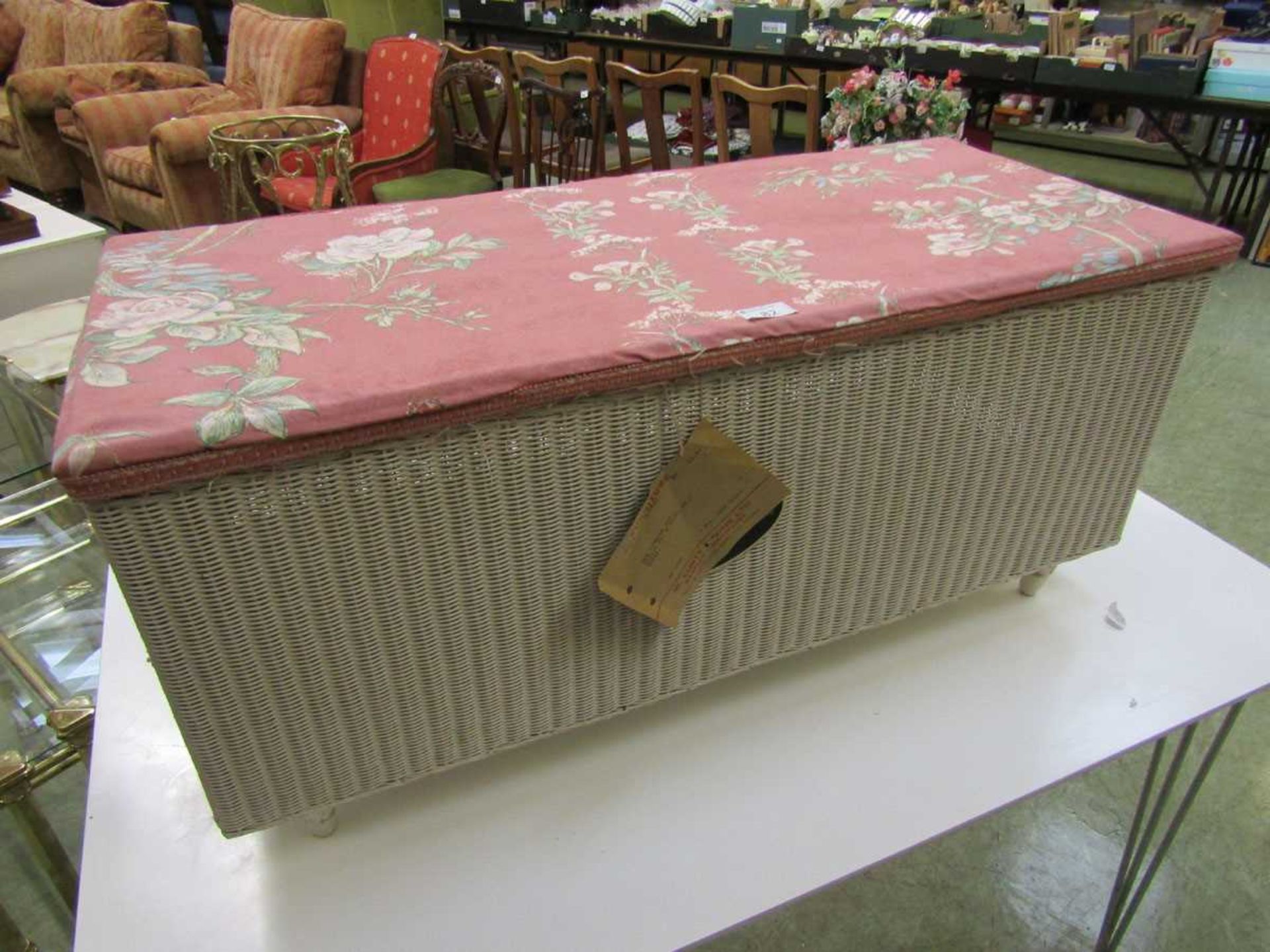 A Lloyd Loom ottoman