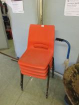 Four plastic metal framed stacking chairs