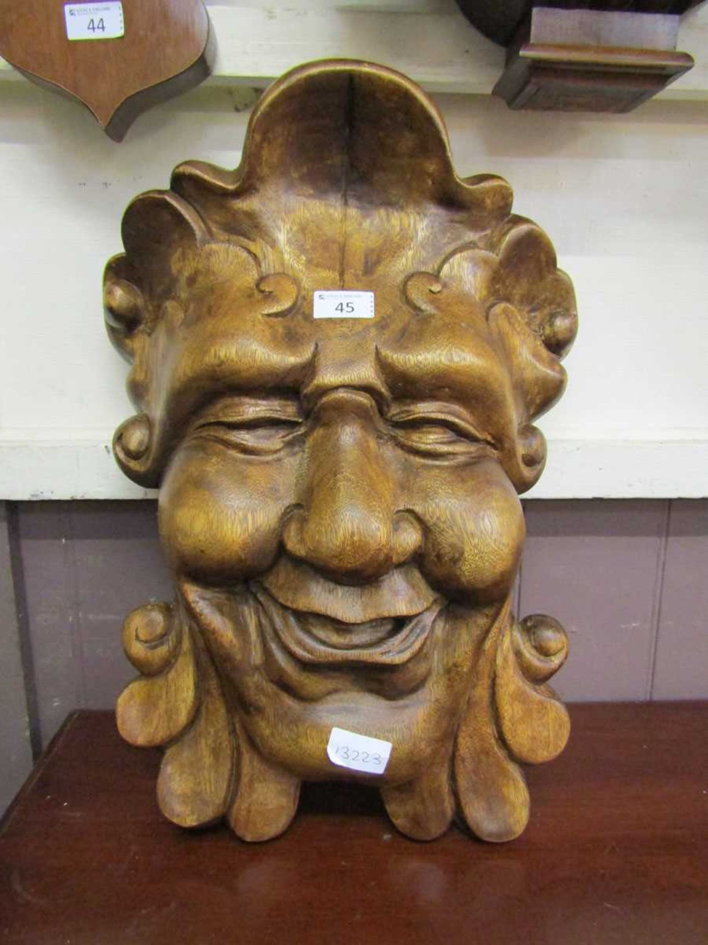 A modern eastern carved wooden face mask