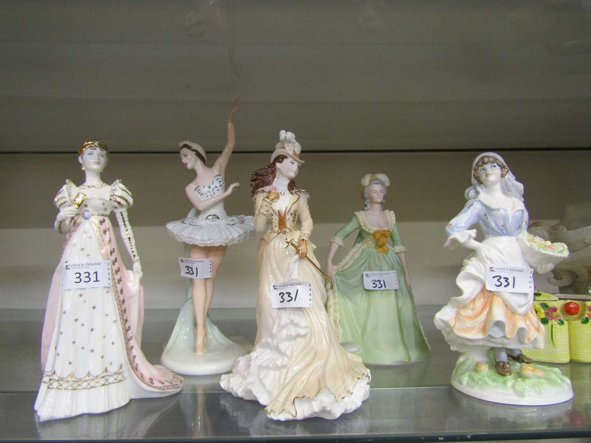 A selection of three Coalport ceramic figurines consisting of 'Empress Josephine', 'Margot Fonteyn',
