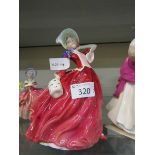 A Royal Doulton ceramic figurine 'Autumn Breezes' HN1934