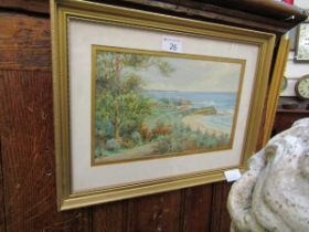 A framed and glazed watercolour of coastal scene