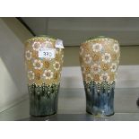 Two blue ground Royal Doulton vases with embossed floral decoration
