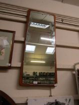 A mid-20th century design teak wall mirror