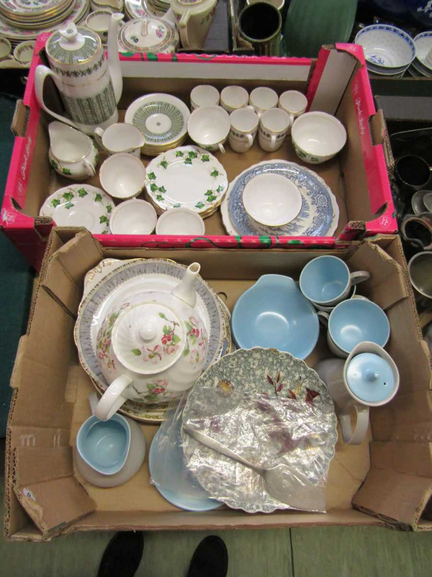 Two trays of ceramic ware to include part Poole Pottery tea service, ivy design part tea set, etc