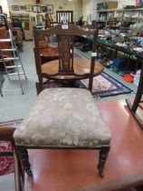 An Edwardian Sheraton revival walnut inlaid bedroom chair