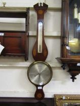 An Edwardian Sheraton revival mahogany inlaid banjo barometer