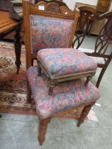 An Edwardian walnut chair with overstuffed seat along with matching stool