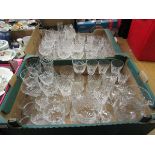 Two trays of cut glassware, mainly drinking vessels