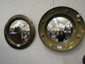 Two brass effect circular wall mirrors