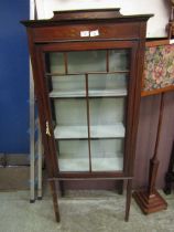 An early 20th century mahogany inlaid glazed display cabinet