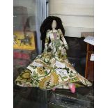 A costume doll dressed in Liberties fabric