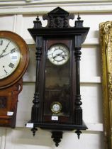 A late Victorian mahogany cased Vienna wall clock