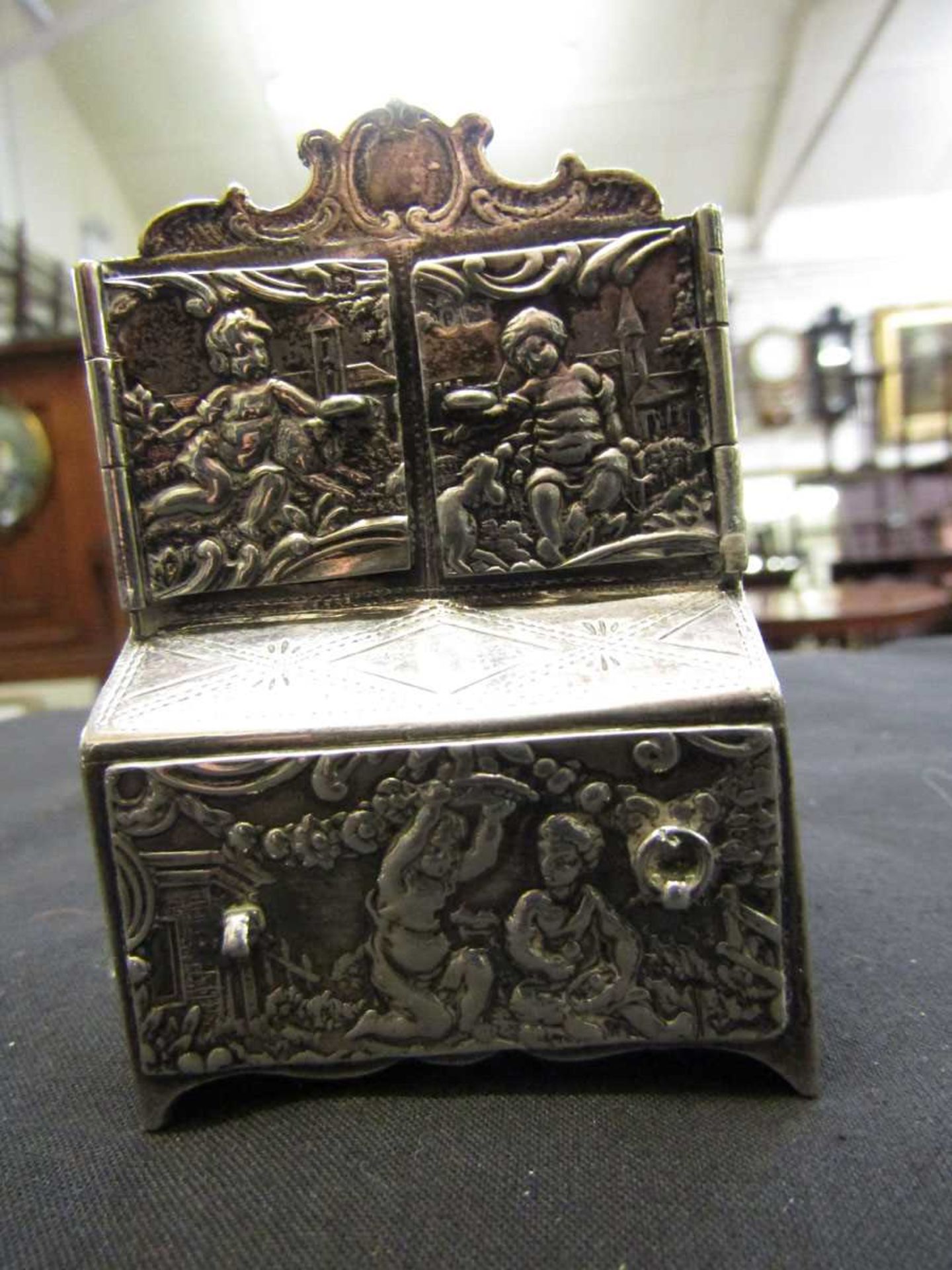 A silver hallmarked embossed miniature dresser