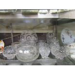A large selection of cut and pressed glassware to include Stuart Crystal rose bowl, serving bowls,