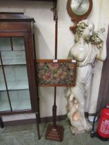 A Victorian mahogany pole screen