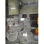 Seven cut and pressed glass decanters to include ship's decanter, port decanter, etc