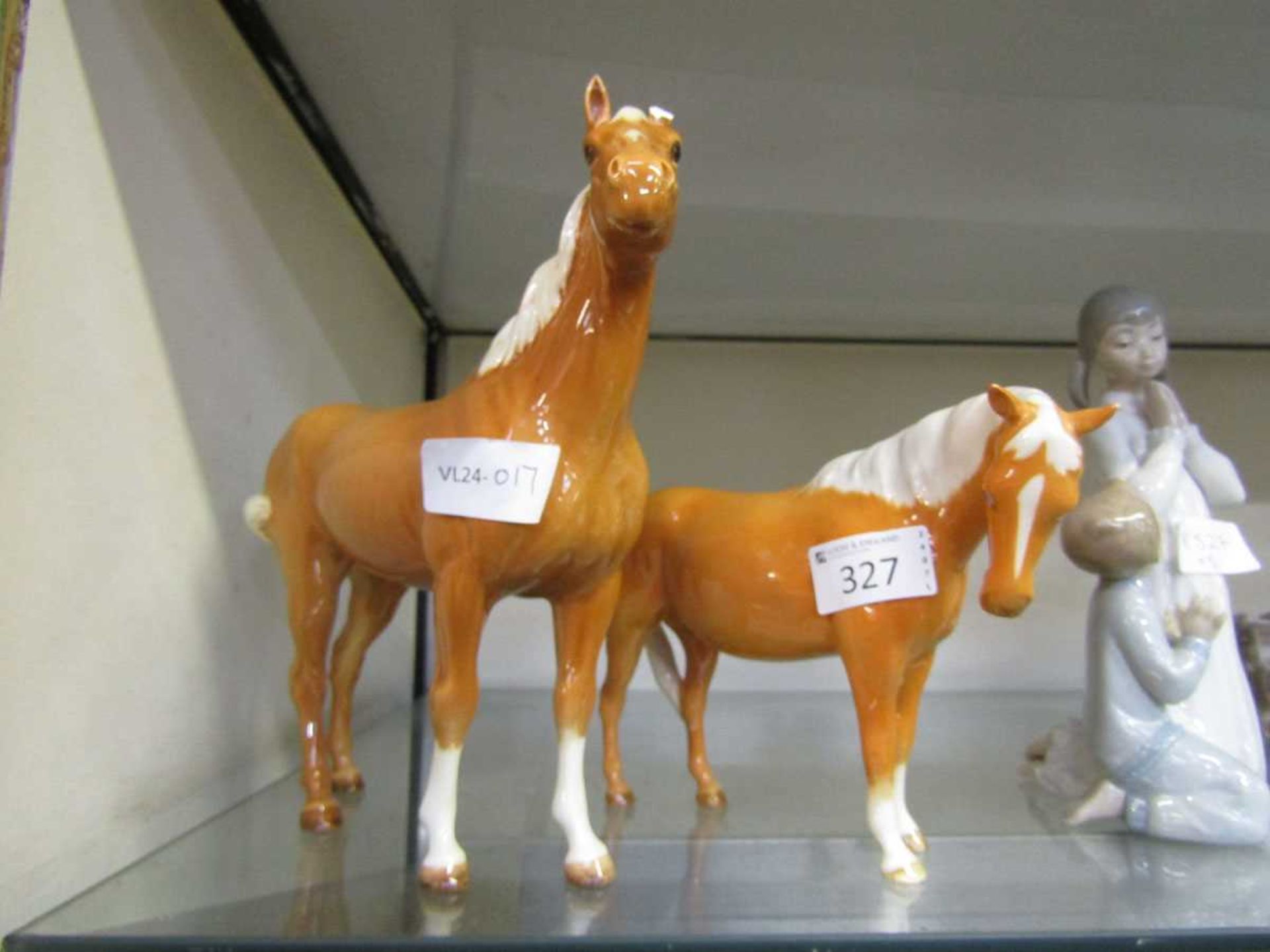 Two Beswick ceramic figurines of Palomino horses (A/F, two legs damaged to smaller)