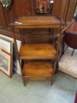 A reproduction mahogany three tier whatnot with drawer to base