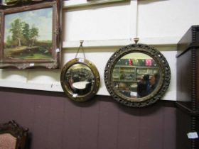 A brass circular convex wall mirror together with a circular gilt framed wall mirror