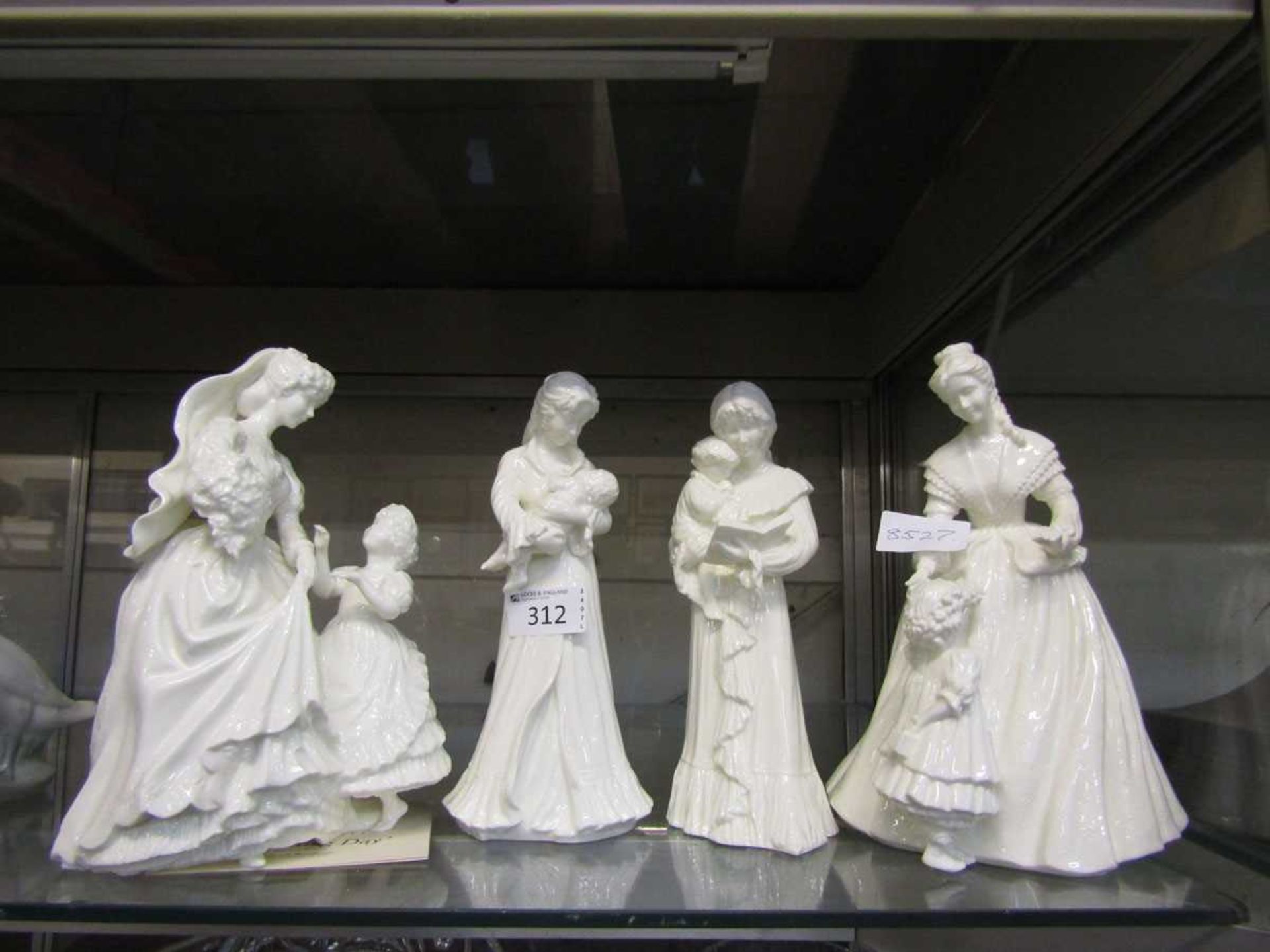 Four Royal Worcester ceramic figurines consisting of two 'Cherished Moments' series figurines; '