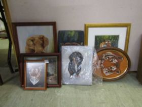 A selection of framed and unframed artworks to include dogs, tigers, etc