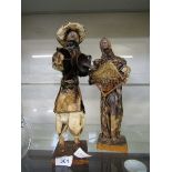 Two papier mache figures of eastern gentlemen