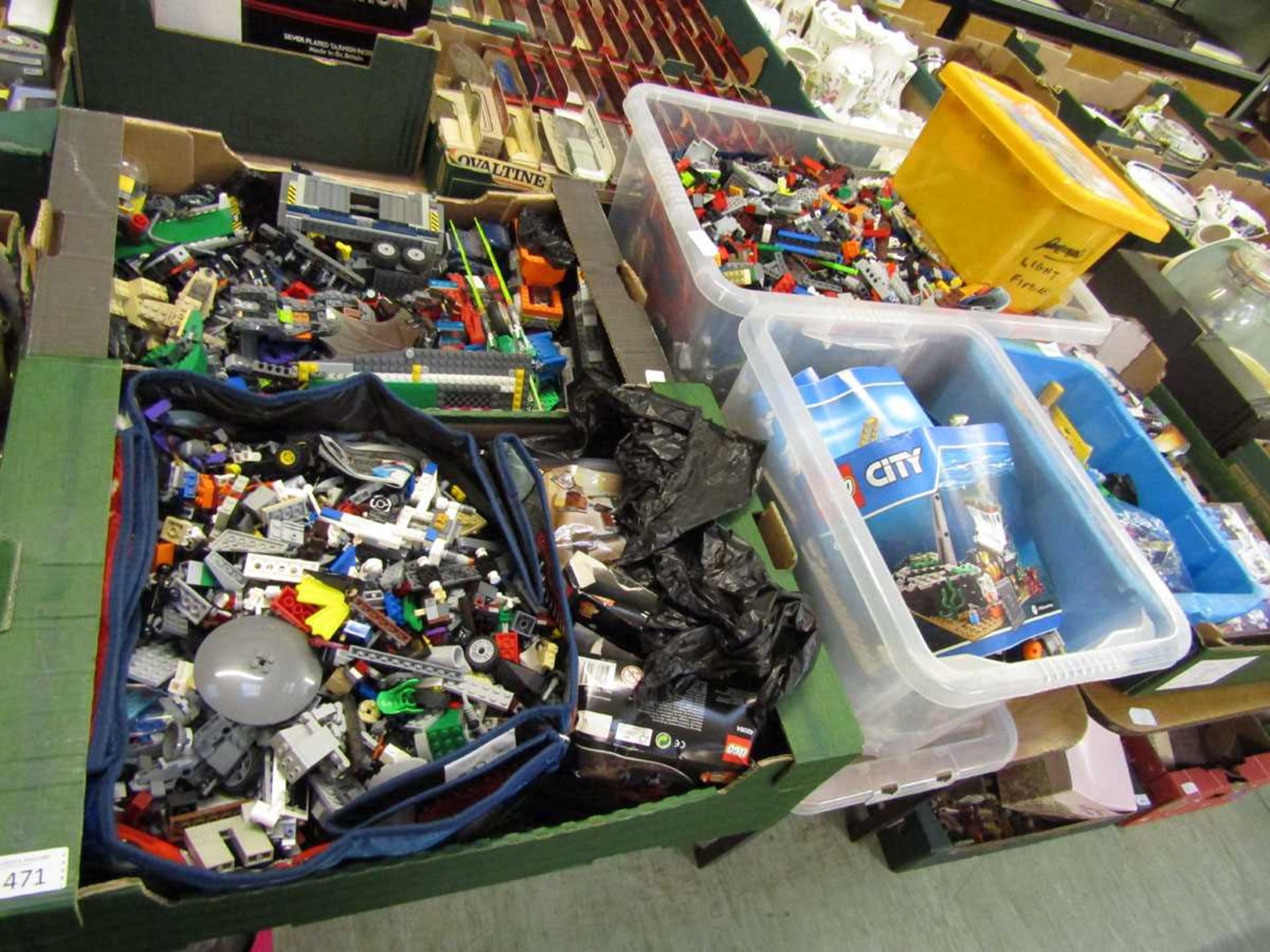 A selection of seven trays and boxes of various LEGO with assorted boxes and instructions