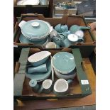 Two trays of Poole Pottery tableware to include coffee pots, plates, cups, saucers, tureens, etc