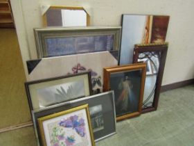 A selection of various artworks to include French religious prints, etc