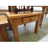 A modern oak low level hall table with single drawer