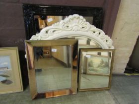 Four assorted framed mirrors