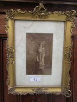 An ornate gilt framed photograph of Victorian lady