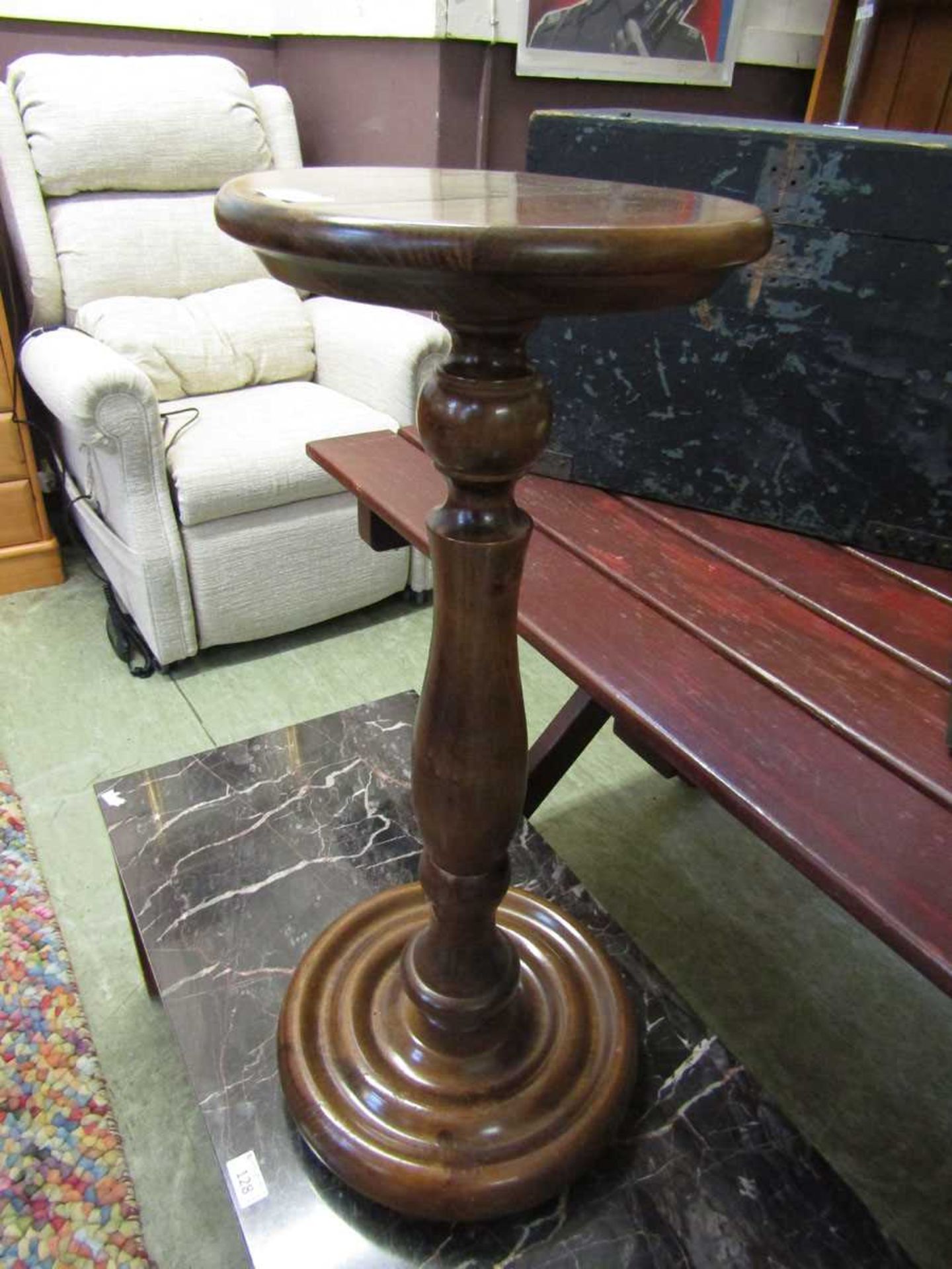 A stained pine jardiniere stand