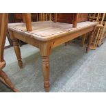 A waxed pine rectangular dining table