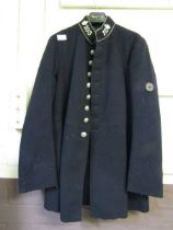 An early 20th century black jacket possibly from St Johns Ambulance or Worcestershire Police