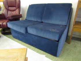 A blue upholstered bed settee