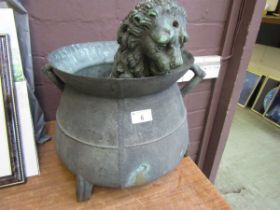 A possible cast bronze water feature of a lion together with a copper twin handled vessel